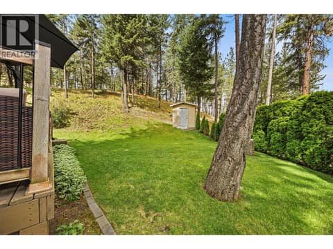 A lush, level backyard provides the perfect space for gardening, lawn games, pets, or simply enjoying the beauty of nature. at 4075 McClain Road Unit# 22, South East Kelowna
