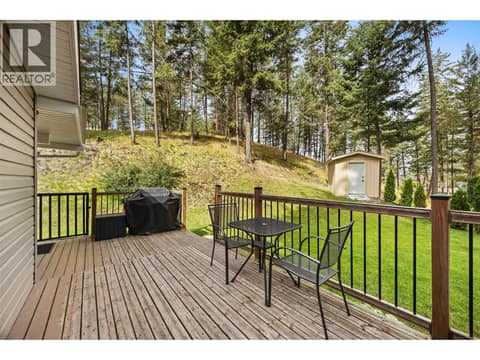 Enjoy peaceful views of the beautifully manicured lawn, mature trees, and established hedging that create an incredible sense of seclusion. at 4075 McClain Road Unit# 22, South East Kelowna