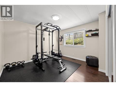 Home Gym Today, Guest Room Tomorrow Currently configured as a fitness room, this versatile bedroom easily adapts to your lifestyle as a guest room, hobby space, or home office. at 4075 McClain Road Unit# 22, South East Kelowna