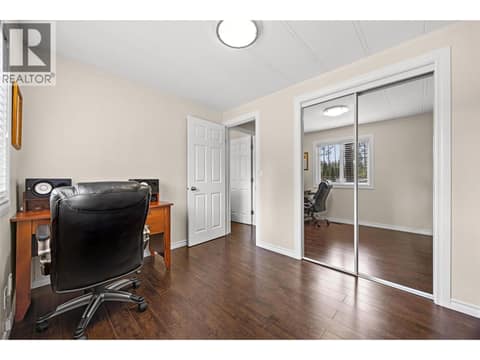 Large windows, generous storage, and neutral finishes make this room ideal for family, guests, or a dedicated workspace. at 4075 McClain Road Unit# 22, South East Kelowna