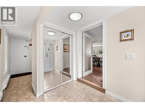 Step inside to a bright, inviting foyer featuring tile flooring, mirrored closet doors, and plenty of space to welcome family and guests. at 4075 McClain Road Unit# 22, South East Kelowna