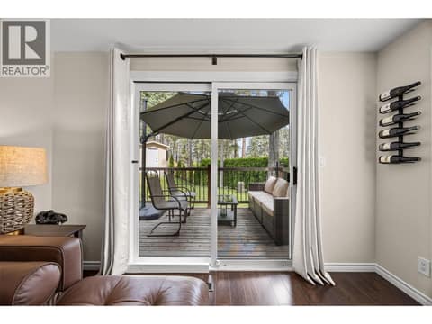Step onto the spacious deck and enjoy peaceful mornings, summer barbecues, or evenings surrounded by mature trees and beautifully landscaped grounds. at 4075 McClain Road Unit# 22, South East Kelowna