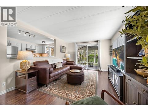 The open-concept living space flows beautifully into the kitchen and dining area, making entertaining family and friends effortless. at 4075 McClain Road Unit# 22, South East Kelowna