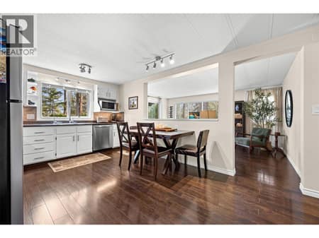 The open-concept design seamlessly connects the kitchen, dining, and living areas, creating an ideal space for everyday living and entertaining. at 4075 McClain Road Unit# 22, South East Kelowna