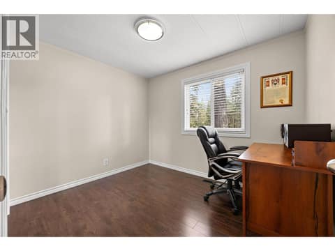 The third bedroom is perfectly suited as a home office while remaining large enough to function as a comfortable guest room or bedroom. at 4075 McClain Road Unit# 22, South East Kelowna
