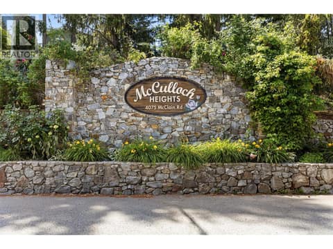 Welcome Home: Arrive through the beautiful stone entrance to McCulloch Heights, a quiet, forested community known for its peaceful surroundings. at 4075 McClain Road Unit# 22, South East Kelowna