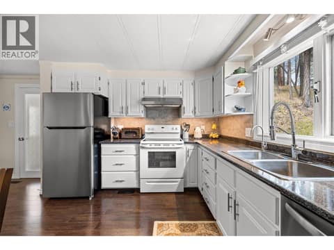 With modern finishes, stainless steel appliances, and plenty of workspace, this kitchen is as functional as it is welcoming. at 4075 McClain Road Unit# 22, South East Kelowna