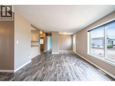 Living room and entrance at 9510 Highway 97 N Unit# 26, Swan Lake West, Vernon