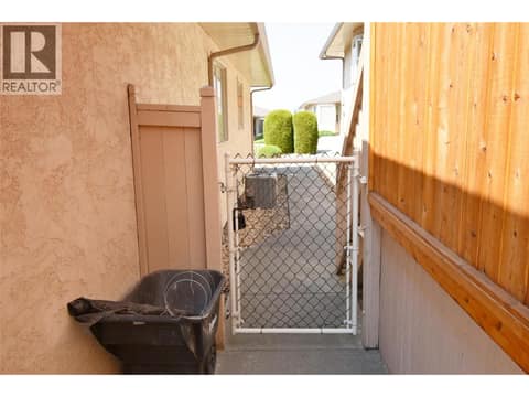 Gate back to front entrance at 3906 Pleasant Valley Road Unit# 19, Harwood, Vernon