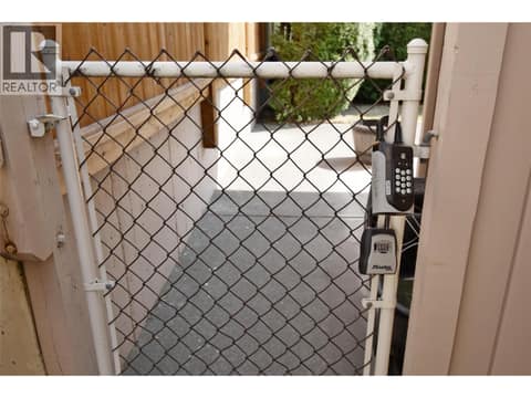 Lockbox on gate to back yard at 3906 Pleasant Valley Road Unit# 19, Harwood, Vernon