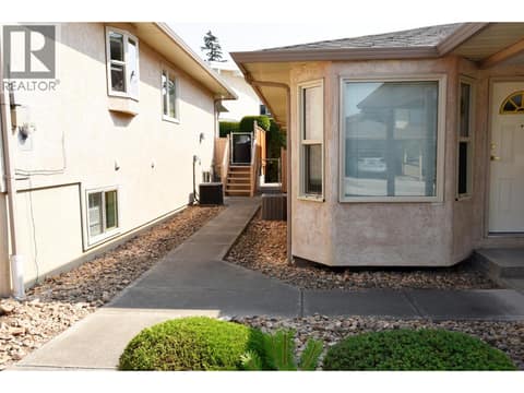 Side entrance to back patio area at 3906 Pleasant Valley Road Unit# 19, Harwood, Vernon