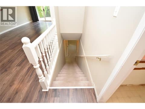Stairs to basement at 3906 Pleasant Valley Road Unit# 19, Harwood, Vernon
