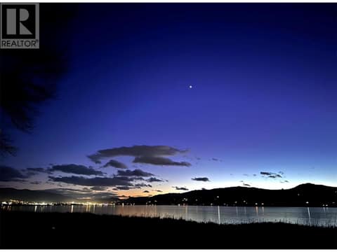 Night view across Swan Lake at 8000 Highland Road Unit# 33, North BX, Vernon