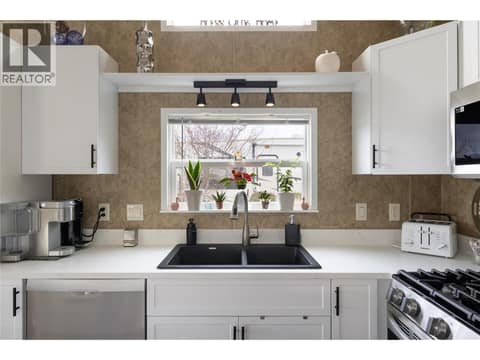 Updated kitchen cabinets, sink, and quartz counters at 8000 Highland Road Unit# 33, North BX, Vernon