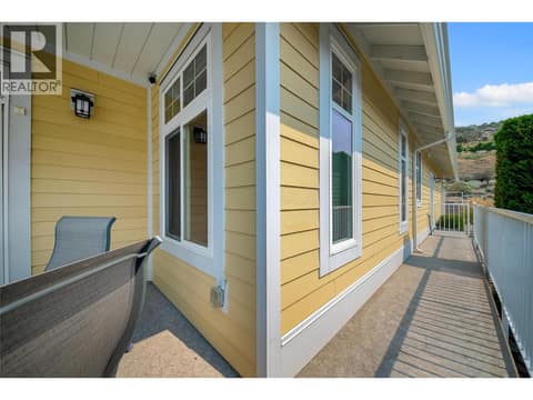 Main Level Deck access to garage man door. at 2450 Radio Tower Road Unit# 279, Oliver Rural