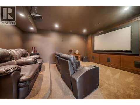 A dedicated media room perfect for movie nights at 336 Quilchena Drive, Kettle Valley, Kelowna
