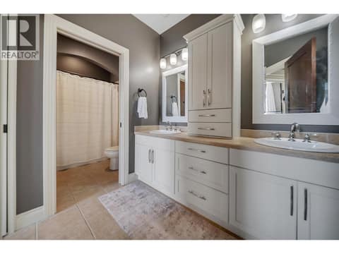 Dual vanities offer plenty of space to get ready in the morning at 336 Quilchena Drive, Kettle Valley, Kelowna