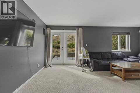 Access from family room to expansive front deck at 743 Mt. Thor Drive, Middleton Mountain Coldstream