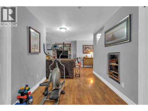 Family room viewed from the garage entry. at 430 McCarren Avenue, Kettle Valley, Kelowna
