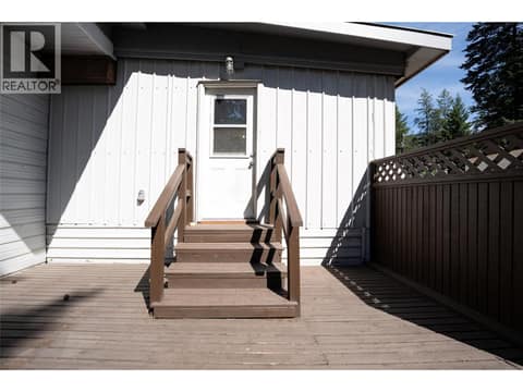Rear Deck - Door leading to Primary Bedroom at 4137 Spallumcheen Drive Unit# 16, Armstrong/ Spall., Spallumcheen