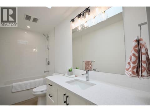Main Bathroom with tile tub surround and quartz counters at 8900 Jim Bailey Road Unit# 126, Lake Country East / Oyama, Kelowna