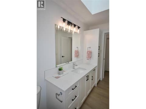 Main Bathroom with tile tub surround and quartz counters at 8900 Jim Bailey Road Unit# 126, Lake Country East / Oyama, Kelowna