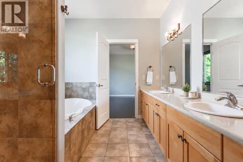 Double sinks custom shower large tub with water closet at 2538 Copper Ridge Drive, Smith Creek, West Kelowna