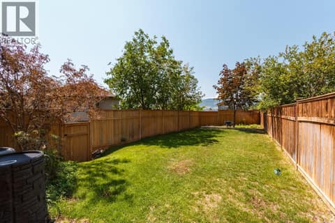 Large flat fenced yard appointed to the upstairs at 2538 Copper Ridge Drive, Smith Creek, West Kelowna