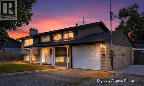 Attached one-car garage. Digitally Altered Photo at 240 Petch Road, Rutland South, Kelowna