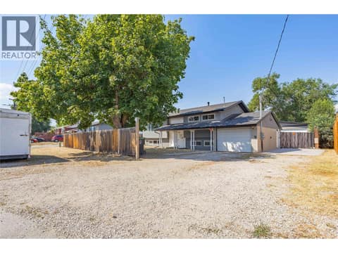 Expansive driveway with ample parking for multiple vehicles, RVs, trailers, or recreational toys. at 240 Petch Road, Rutland South, Kelowna