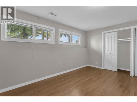 First bedroom on the lower level at 240 Petch Road, Rutland South, Kelowna
