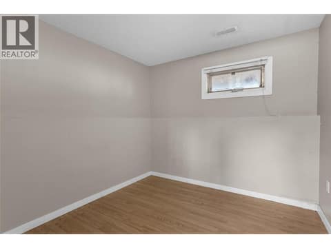 Second bedroom on the lower level at 240 Petch Road, Rutland South, Kelowna
