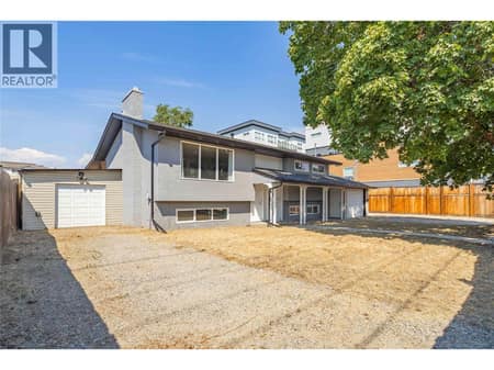 Spacious front yard and attached shed at 240 Petch Road, Rutland South, Kelowna