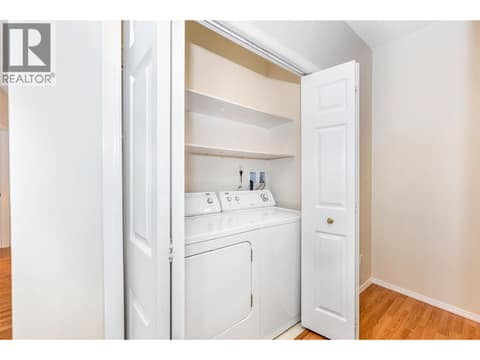 Hallway closet is hosting the laundry appliances at 3805 30 Avenue Unit# 112, City of Vernon