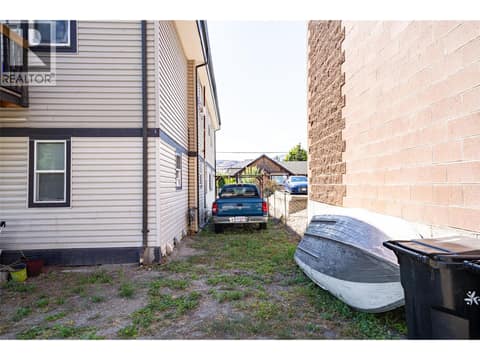 View of the north side of the building between the building and the commercial building next door at 3601 31 Street, City of Vernon