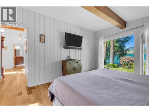 Bedroom with bright views at 12110 Trewhitt Road W, Lake Country East / Oyama