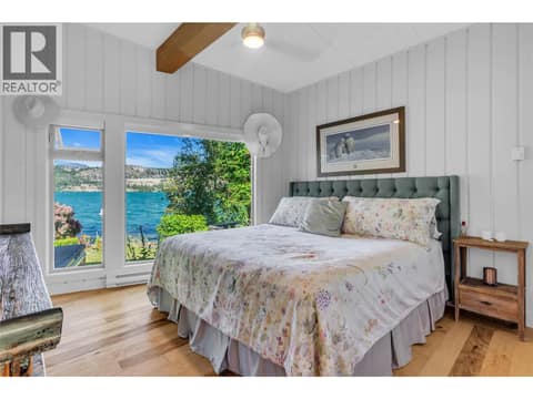 Bedroom with lake views at 12110 Trewhitt Road W, Lake Country East / Oyama