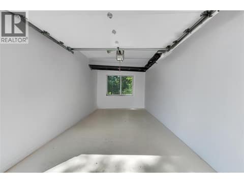 Garage with showroom floor at 12110 Trewhitt Road W, Lake Country East / Oyama