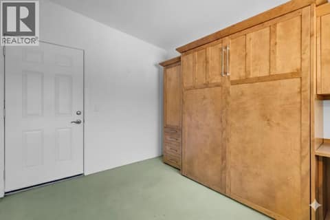 Guest room with murphy bed at 12110 Trewhitt Road W, Lake Country East / Oyama