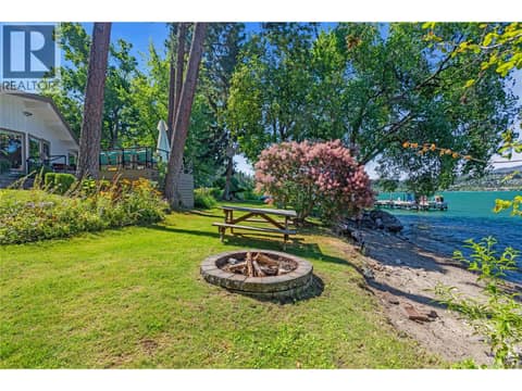 Picnic table and firepit on the beach at 12110 Trewhitt Road W, Lake Country East / Oyama