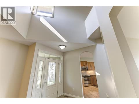 Soaring 17' ceilings in Entry at 3800 Gallaghers Pinnacle Way Unit# 29, South East Kelowna
