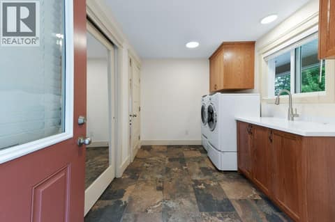 Lakeview House Carport Entry with Mudroom/Laundry at 4852-4858 Lakeshore Road, Upper Mission, Kelowna