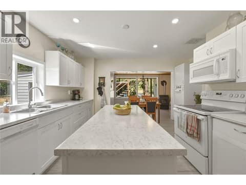 Kitchen looking towards dining area at 244 Mabel Lake Road, Lumby Valley
