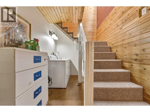 Laundry area upper level stairs at 244 Mabel Lake Road, Lumby Valley