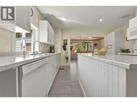 Remodeled kitchen with movable island at 244 Mabel Lake Road, Lumby Valley