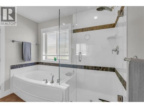 Soaker tub or gorgeous glass shower at 2493 Ironridge Road, Smith Creek, West Kelowna