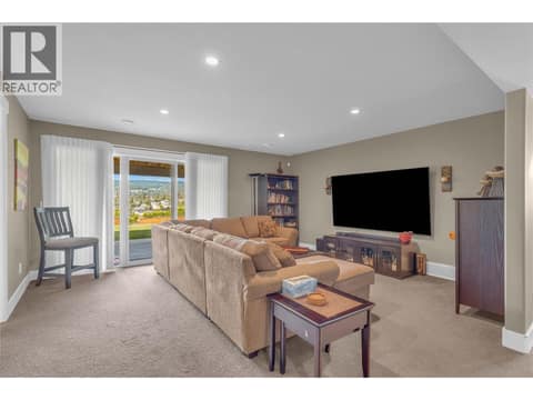 Spacious family room downstairs at 2493 Ironridge Road, Smith Creek, West Kelowna