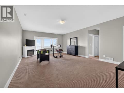 Lower Level Family Room with Access to 3rd Bedroom at 1040 Mt Revelstoke Place Unit# 14 Lot# 20, Middleton Mountain Vernon