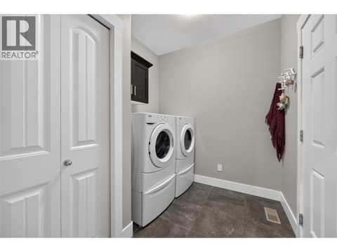 Main Level Laundry Room Leading to 2 Car Garage at 1040 Mt Revelstoke Place Unit# 14 Lot# 20, Middleton Mountain Vernon