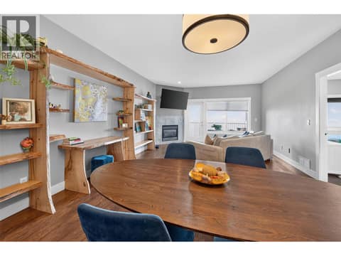Open Plan Main Living Space with Gas Fireplace and Access to Covered Deck at 1040 Mt Revelstoke Place Unit# 14 Lot# 20, Middleton Mountain Vernon